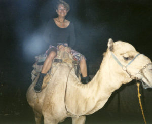 Ann-Marie Cheung riding a camel, Luxor, Egypt